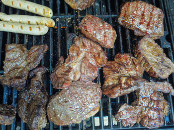 High angle view of meat on barbecue