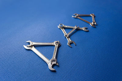 Close-up of chain against blue background