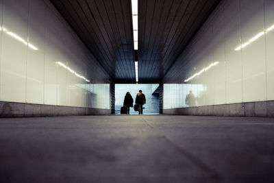 People walking in subway tunnel