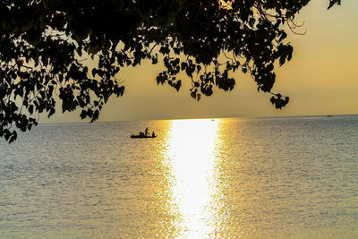 Scenic view of sea against sky at sunset