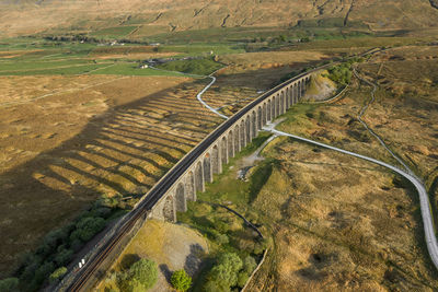 High angle view of road amidst field