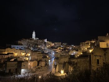 Illuminated buildings in city at night