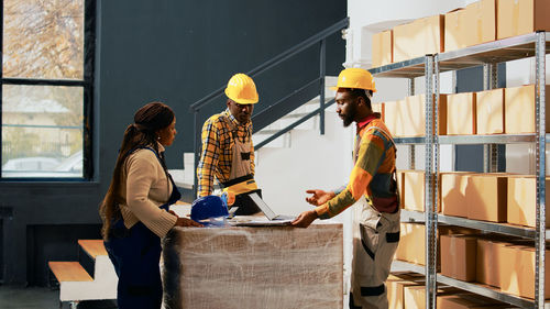 Side view of man working at construction site