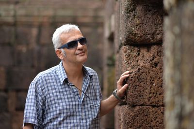 Portrait of smiling man standing outdoors
