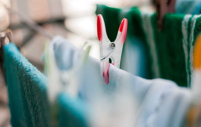 Close-up of clothespins on clothesline