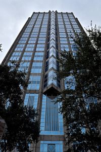 Low angle view of skyscraper against sky