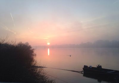 Scenic view of sunset over river