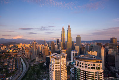 Panoramic view of cityscape against sky during sunset