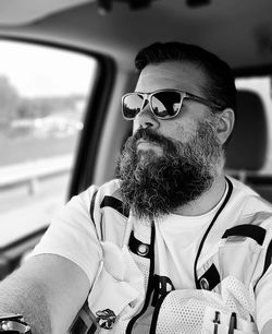 Man driving with beard