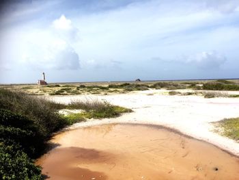 Scenic view of sea against cloudy sky