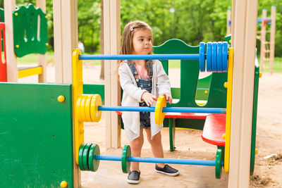 Girl playing on slide at playground
