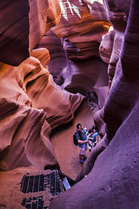 High angle view of people on rock