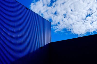 Low angle view of building against blue sky