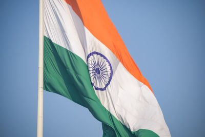 India flag flying high at connaught place with pride in blue sky, india flag fluttering, indian flag