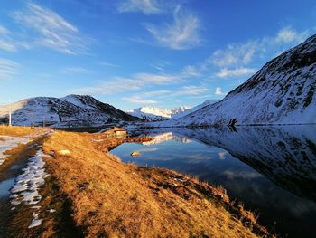 Scenic view of snowcapped mountains against sky