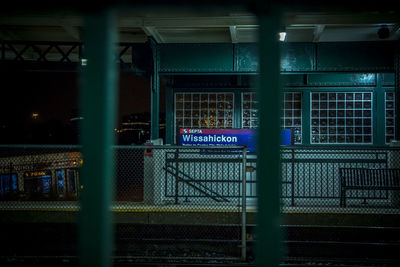 Illuminated text on railroad station at night