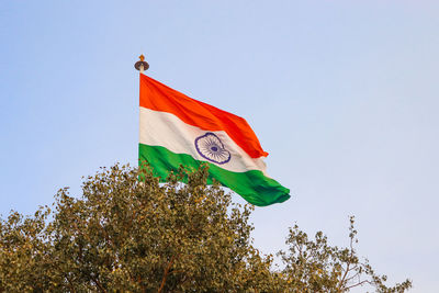 Low angle view of flag against sky