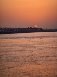 Scenic view of beach against sky during sunset