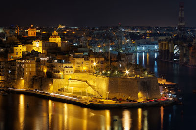 High angle view of illuminated buildings at night