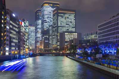 Illuminated buildings in city at night