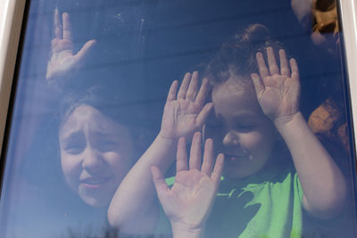 Portrait of people in glass window