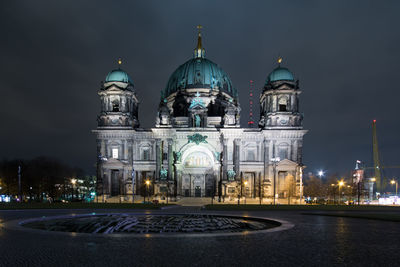 Illuminated cathedral against sky at night