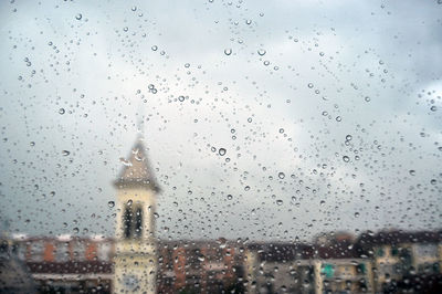 Raindrops on glass window during rainy season