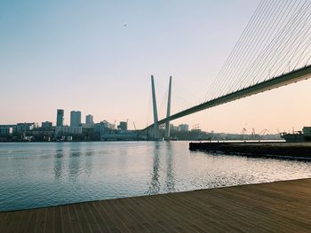 Bridge over river with buildings in background