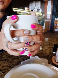 Close-up of woman holding coffee cup