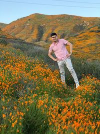 Full length of man standing on field