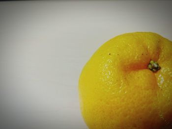 Close-up of lemons over black background