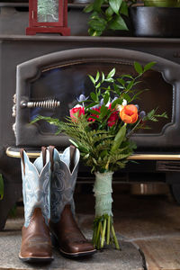 Wedding bouquet with bride's cowboy boots