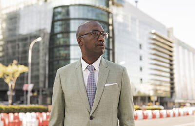 Mature businessman with eyeglasses in financial district