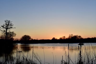 Scenic view of lake during sunset