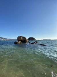 Scenic view of sea against clear sky