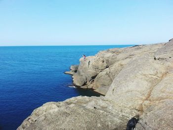 Scenic view of sea against clear blue sky