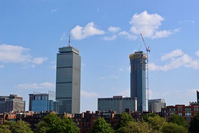 Modern buildings in city against sky