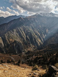 Scenic view of landscape and mountains against sky