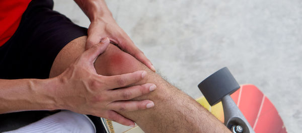 Midsection of man holding hands