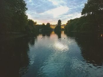 Reflection of trees in lake against sky