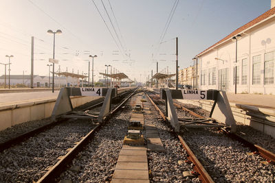 Railroad tracks in train against sky