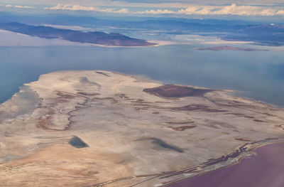 Aerial view from airplane of the great salt lake in rocky mountain range in utah, united states.