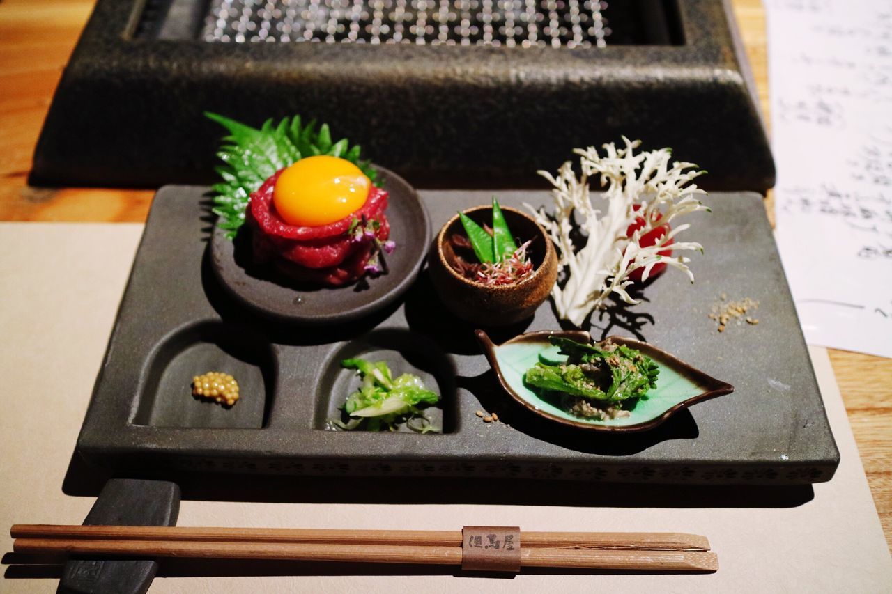 indoors, table, still life, freshness, flower, wood - material, high angle view, close-up, home interior, potted plant, decoration, no people, vase, variation, flower pot, food and drink, food, selective focus, focus on foreground, multi colored