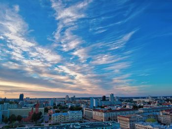 High angle shot of townscape against sky at sunset