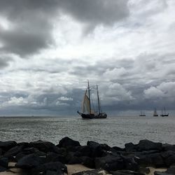 Scenic view of sea against cloudy sky