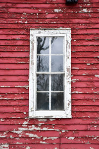 Red weathered farmhouse window