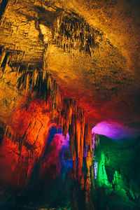 Low angle view of illuminated cave