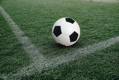 Close-up of soccer ball on field