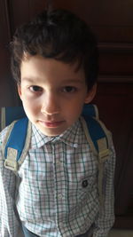 Portrait of boy wearing school uniform