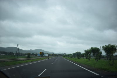 View of road against cloudy sky